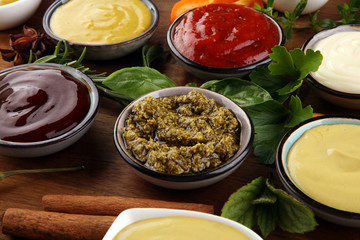 Sauces Assortment. Set of various sauces in bowls with ketchup, mayonnaise, pesto and mustard. Variety of induvidual marinades.