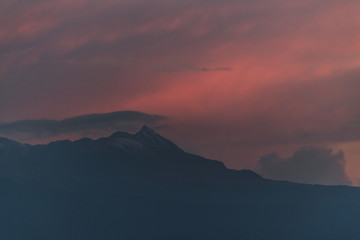 Detail landscape of the Nevado de Toluca, with the points full of nine, photo at sunset with mertiolate colors, with clouds