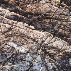 Stone texture, volcanic rock structure layers. geometric natural composition of different minerals in the stone. flat lines, unusual shape of the surface of volcanic rocks