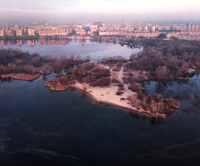 Fototapeta na wymiar Aerial view of Obolon in the spring and Obolonsky island in Kyiv, Ukraine.
