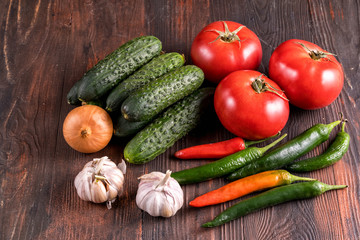 Fresh vegetables on wooden table.