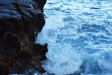 
Mediterranean sea water crashing into rocks