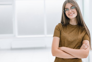 friendly young woman standing in spacious office