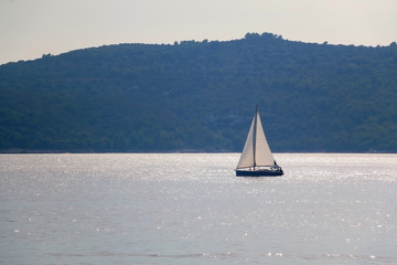 Sailing boat on the sea in southern Dalmatia region in Croatia. Beautiful landscape and bright summer day.