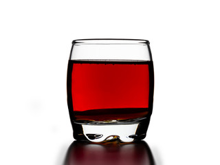glass of red liquor silhouette with shadow on white background