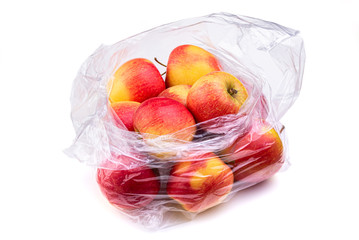 Apples in a plastic bag. Isolate on white background