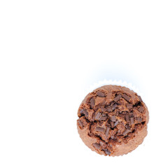 Chocolate birthday cupcakes with a cocoa frosting on top with dessert cutlery, on white background, horizontal