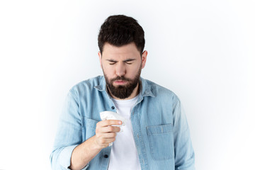 young man sick, flu and bronchitis cough, on isolated background