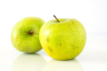Green apple on a white background. Granny smith
