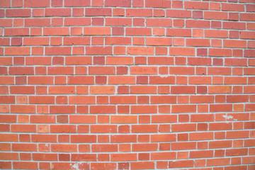 Exposed red brick wall texture as background and design element