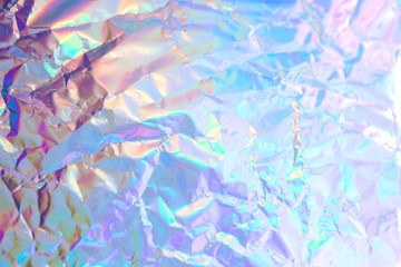 Abstract radiant festive backdrop texture image of holographic bokeh iridescent metallic foil