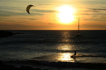 kite surfing at sunset