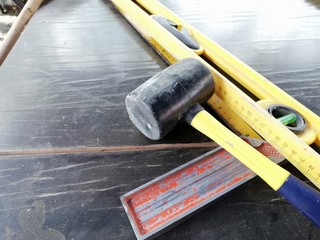 tool for marking and installing ceramic tiles. spirit level, rubber hammer, mallet and protractor