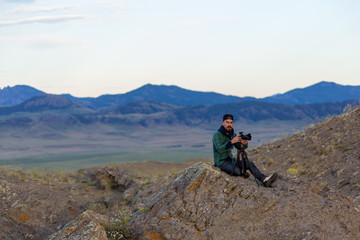 Fototapeta premium photographer on top of mountain 