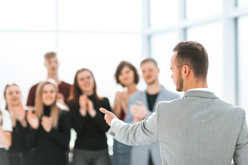 Obraz premium blurred image of a group of young people applauding their speak