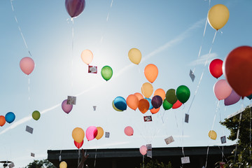 photo of colorful helium balloons flying in the sky