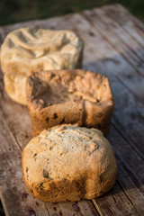 Fresh rye bread or whole grain bread on dark table background. Healthy baked bread in slices, whole homemade bread. Organic farm food. 