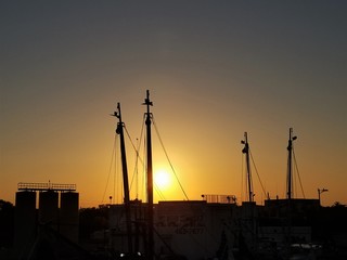 docked commercial fishing boats at sunset