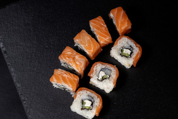 Close up delicious Japanese food sushi over dark background with copy space