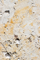 abstract texture of coastal white stone with red stripes for background, close-up