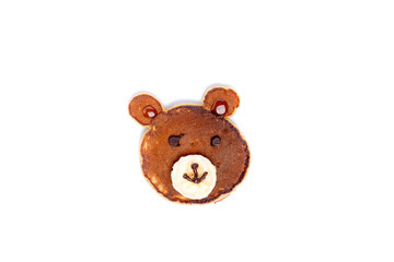 Flat lay composition with pancakes in form of bear isoleted on white background. Creative breakfast ideas for kids