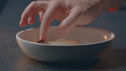 hand imposes food
cook beautifully lays slices of planed wild boar
chef wild boar lays a shamrock on food
decorates the dish
hands put on a plate
close-up 4.6K