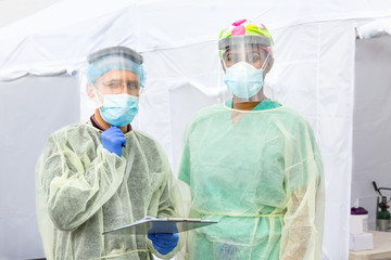 Frontline Epidemic Medical providers in Protective Gear Caring for Patients.