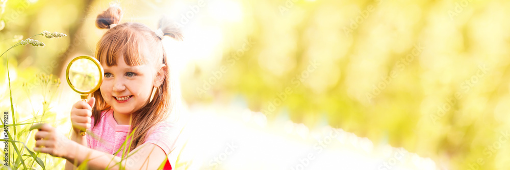 Poster Little girl exploring plant outdoors on sunny day. Banner design