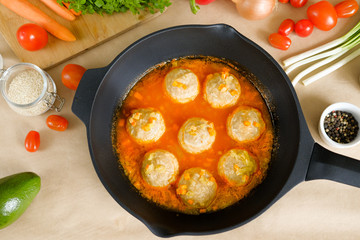 appetizing meatballs in a sauce stew in a pan. Top view