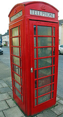 Fototapeta premium Red Phone Box on a village street
