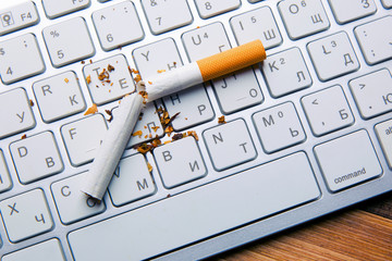 Broken filter cigarette on keyboard
