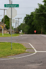 Back of stop sign with street sign visible above