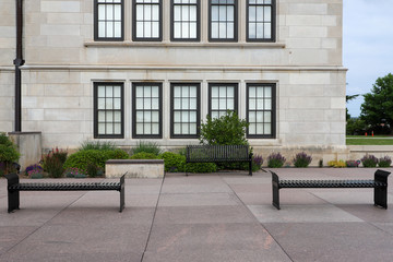 Benches along the front of a windowed building