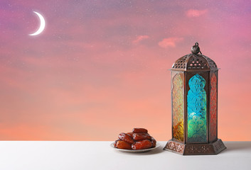 Traditional Ramadan lantern and dates on table. Muslim holiday