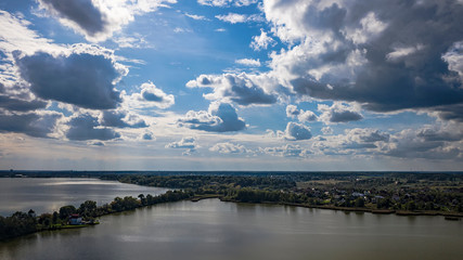 Aerial view of the lake in the middle climatic zone , roads and villages surrounding