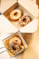 Doughnuts preparation, chocolate and chopped hazelnuts