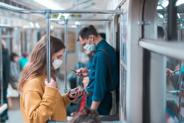 variety of passengers ride the subway car - obrazy, fototapety, plakaty