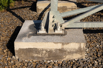 Concrete mounts for overhead transmission line support.