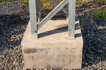 Fototapeta na wymiar Concrete mounts for overhead transmission line support.