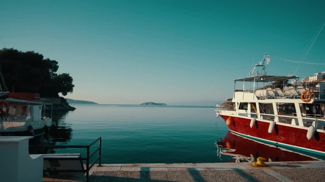 beautiful sea background for text. sea pier, 4k, sea in greece, skiathos island. old red ship,