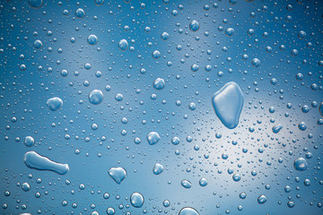 drops of water on glass after raining on the sky, dew. Abstract, postcard, transparent background.