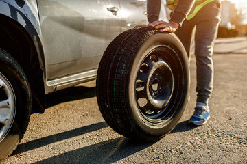 Close-up of a car tire. The driver should replace the old wheel with a spare