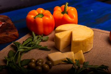 Cheese with serrano ham, olives on a table for a party with friends or as an aperitif