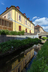 Fototapeta na wymiar Eger creek in Eger, Hungary on a sunny spring afternoon.