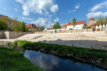 Obraz premium Eger creek in Eger, Hungary on a sunny spring afternoon.
