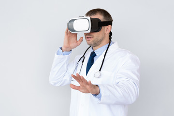 Male Doctor Using Virtual Reality Headset For Medical Purposes