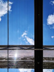 Reflection Of Blue Sky On Glass Window