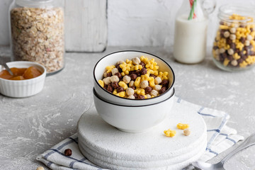 Assorted breakfast cereals: chocolate balls and honey stars