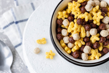 Assorted breakfast cereals: chocolate balls and honey stars