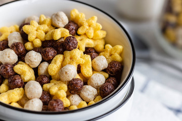 Assorted breakfast cereals: chocolate balls and honey stars